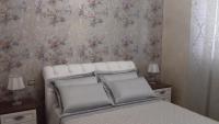 A bed or beds in a room at Daphnae House