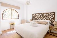 A bed or beds in a room at Apartamento Garcia Lorca III