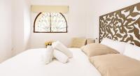 A bed or beds in a room at Apartamento Garcia Lorca III
