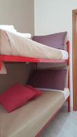 Posteľ alebo postele v izbe v ubytovaní Loft Baia Di Giardini