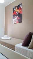 Posteľ alebo postele v izbe v ubytovaní Loft Baia Di Giardini