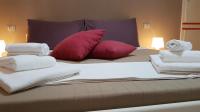 Posteľ alebo postele v izbe v ubytovaní Loft Baia Di Giardini