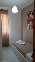 Posteľ alebo postele v izbe v ubytovaní Loft Baia Di Giardini