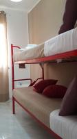 Posteľ alebo postele v izbe v ubytovaní Loft Baia Di Giardini