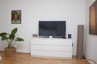 Televízia a/alebo spoločenská miestnosť v ubytovaní Apartman Allegria