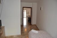 Televízia a/alebo spoločenská miestnosť v ubytovaní Apartments Figueres