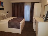 Łóżko lub łóżka w pokoju w obiekcie Hotel Argentum