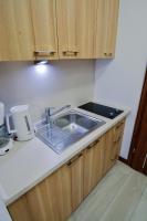 Kuchyňa alebo kuchynka v ubytovaní Apartamenty na Wyspie - Aquamarina - Budynek A - B - C