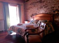 A bed or beds in a room at PICO SACRO II HOTEL Santiago de Compostela