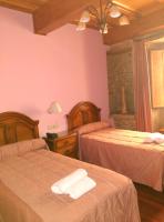 A bed or beds in a room at PICO SACRO II HOTEL Santiago de Compostela