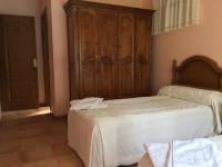 A bed or beds in a room at Os Arroxos