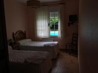 A bed or beds in a room at Os Arroxos