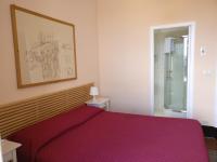 A bed or beds in a room at B&B Porta della Terra
