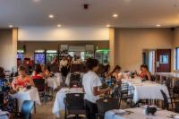 a group of people sitting at tables in a restaurant at Springbok Inn in Springbok
