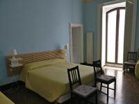 A bed or beds in a room at B&B Porta della Terra
