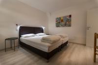 Posteľ alebo postele v izbe v ubytovaní Residence Parco Lago di Garda