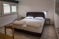 Posteľ alebo postele v izbe v ubytovaní Residence Parco Lago di Garda