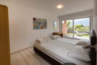 Posteľ alebo postele v izbe v ubytovaní Residence Parco Lago di Garda