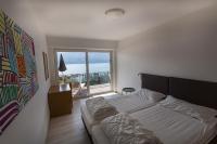 Posteľ alebo postele v izbe v ubytovaní Residence Parco Lago di Garda