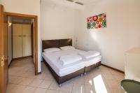 Posteľ alebo postele v izbe v ubytovaní Residence Parco Lago di Garda