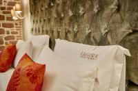 A bed or beds in a room at L'Agora Old Town Hotel & Bazaar