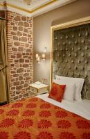 A bed or beds in a room at L'Agora Old Town Hotel & Bazaar