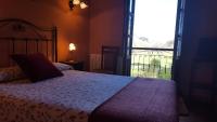 Hotel Rural Casa Cuetoにあるベッド