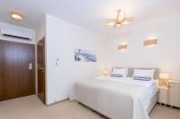 Hotel Szlak Bursztynowyにあるベッド