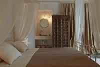 A bed or beds in a room at Dimore Santagaeta
