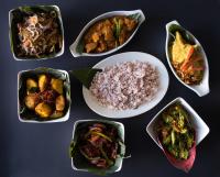 a group of different dishes of food on a table at The Golf Green City Bungalow in Nuwara Eliya