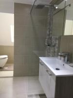A bathroom at Enjoyit Rooms