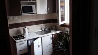 Kuchyňa alebo kuchynka v ubytovaní Apartmani Stonewood