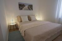 Posteľ alebo postele v izbe v ubytovaní Paula Apartment