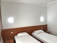 Postel nebo postele na pokoji v ubytování Hotel AL KARMEL