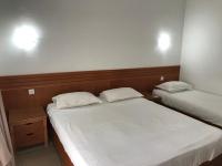 Postel nebo postele na pokoji v ubytování Hotel AL KARMEL