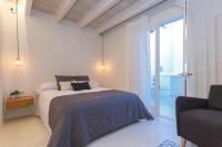 A bed or beds in a room at Hotel S'Estil-let