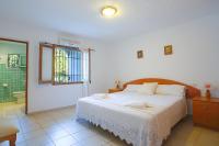 Postel nebo postele na pokoji v ubytování Villa Cifre