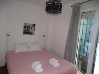 Posteľ alebo postele v izbe v ubytovaní Málaga Apartamentos - Pozos Dulces, 22
