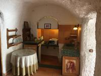 Postel nebo postele na pokoji v ubytování Casas Cueva y Cortijo La Tala en Guadix