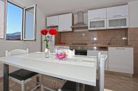 Kuchyň nebo kuchyňský kout v ubytování Apartments Ukic