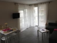 Televízia a/alebo spoločenská miestnosť v ubytovaní Dado Apartments