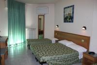 A bed or beds in a room at Albergo Napoleone