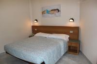 A bed or beds in a room at Albergo Napoleone