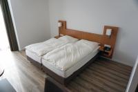 Postel nebo postele na pokoji v ubytování Hotel Chrisma