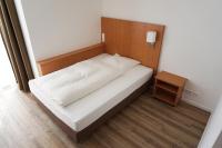 Postel nebo postele na pokoji v ubytování Hotel Chrisma
