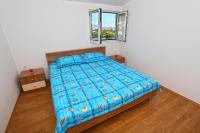 Postel nebo postele na pokoji v ubytování Apartments Ukic