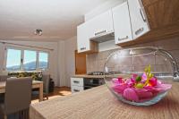 Kuchyň nebo kuchyňský kout v ubytování Apartments Ukic