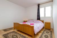 Postel nebo postele na pokoji v ubytování Apartments Ukic