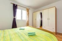 Postel nebo postele na pokoji v ubytování Apartments Ukic