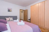 Posteľ alebo postele v izbe v ubytovaní Melita Center Apartment